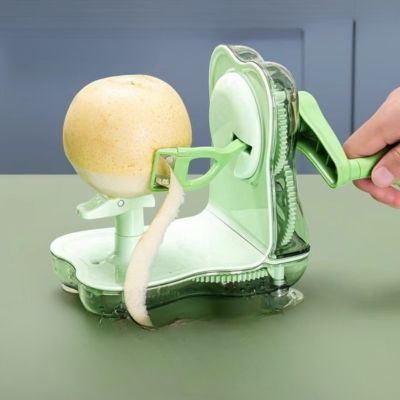 pèle pommes vert pratique avec manivelle pour éplucher une pomme jaune